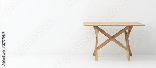 Foldable wooden table with rectangular top and crossed legs on white background perfect for minimalist design and advertising copy space photo