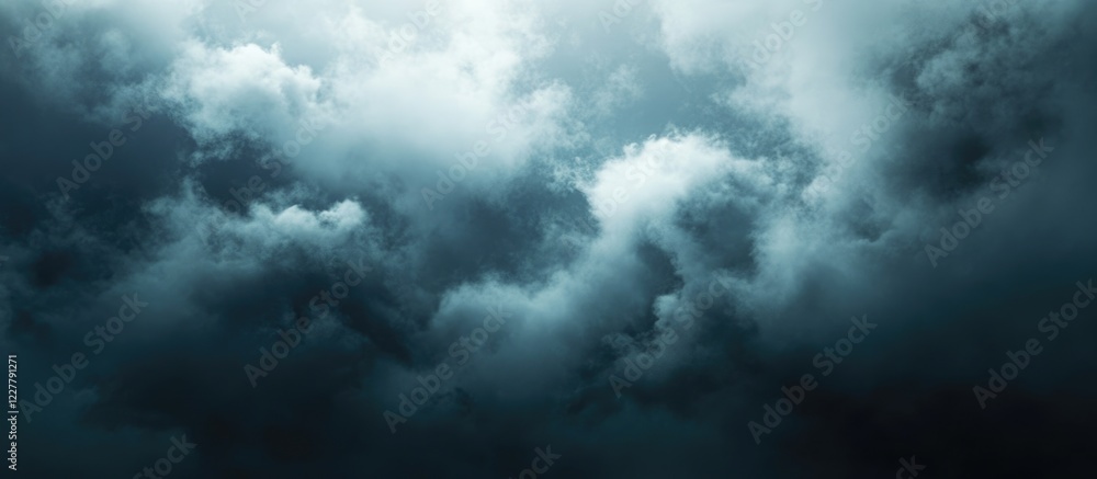 Dark and moody cloudy sky background with ample empty space for text or design elements in a vertical layout Dark and moody cloudy sky background with ample empty space for text or design elements in a vertical layout