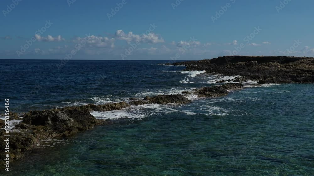 sea waves crashing against the rocky coastline sea waves crashing against the rocky coastline