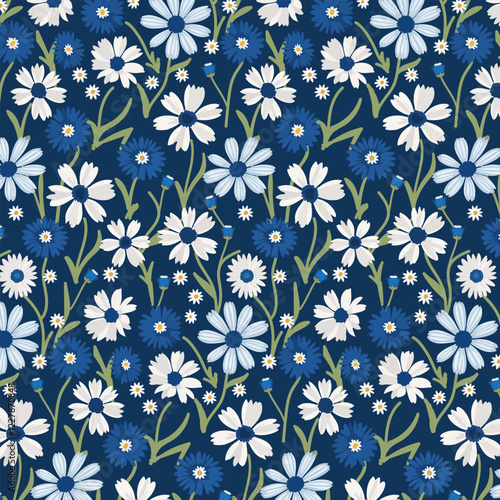 Pattern with white and blue flowers.Vector pattern with cornflowers and daisies on a blue background.