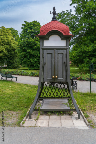 Canvas Print old wooden telephone box in stockholm