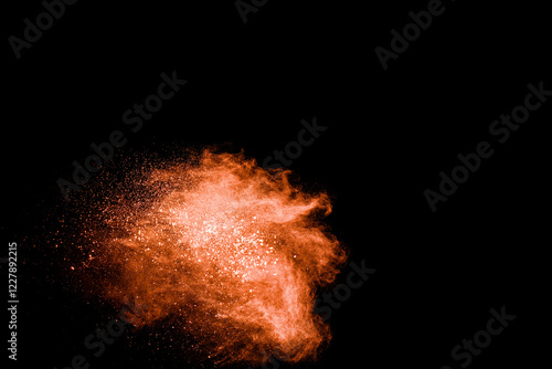 Bright orange cloud of smoke is rising from the ground