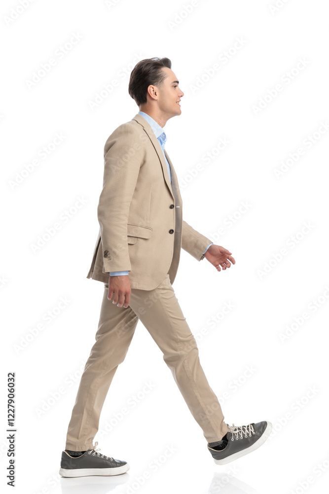 side view of smart casual man walking