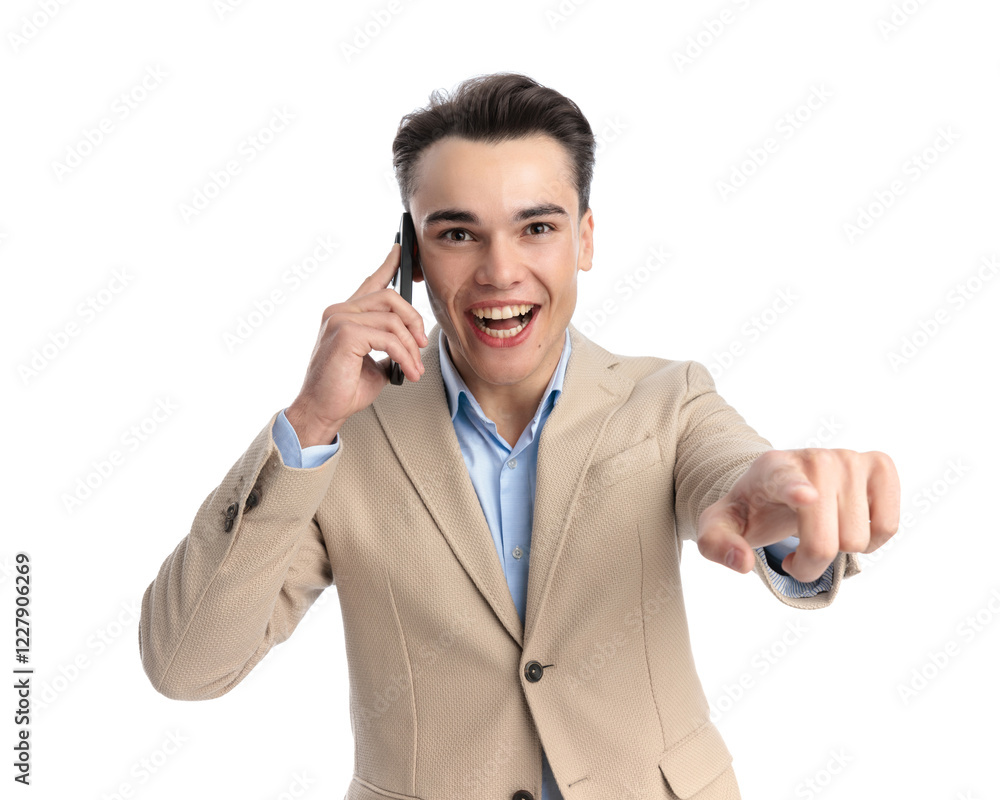 smart casual man speaking on telephone and pointing finger
