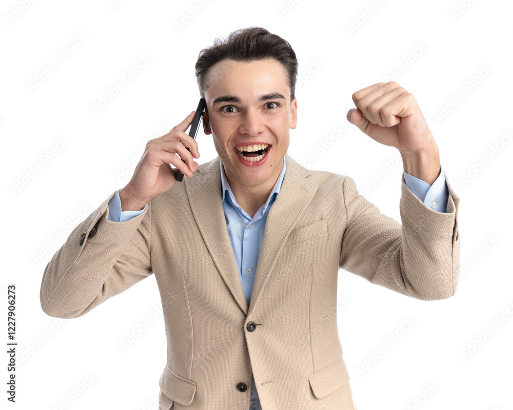 young businessman speaking on the telephone and celebrating young businessman speaking on the telephone and celebrating