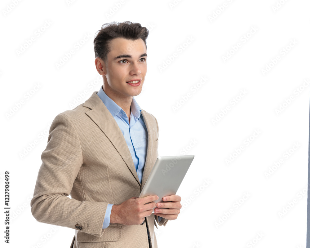 young businessman holding tablet is looking to side young businessman holding tablet is looking to side