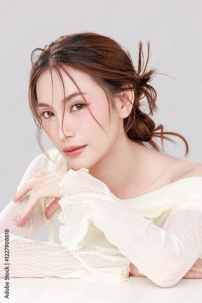 Portraits of young Asian woman K beauty natural makeup face with clean fresh skin on gray background, Facial and skin care concept for commercial advertising. Portraits of young Asian woman K beauty natural makeup face with clean fresh skin on gray background, Facial and skin care concept for commercial advertising.