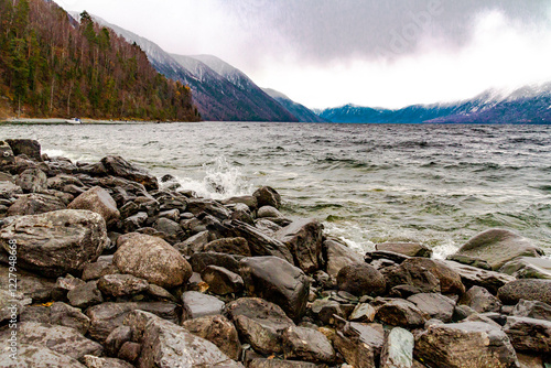 Stone on the Teletskoye lake shore in rainy autumn, Altai, Siberia, Russia, October photo