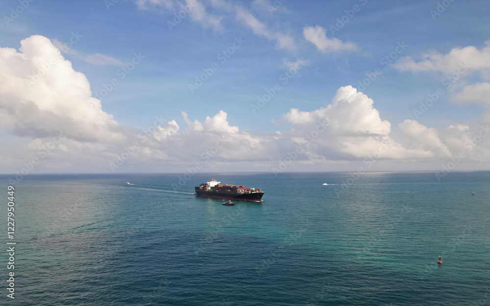 Cargo ship in sea, aerial view. Freight container loaded on cargo vessel. Aerial view cargo ship entering harbor. Cargo business. Container ship. Shipping logistics. Ocean freight transport Cargo ship in sea, aerial view. Freight container loaded on cargo vessel. Aerial view cargo ship entering harbor. Cargo business. Container ship. Shipping logistics. Ocean freight transport
