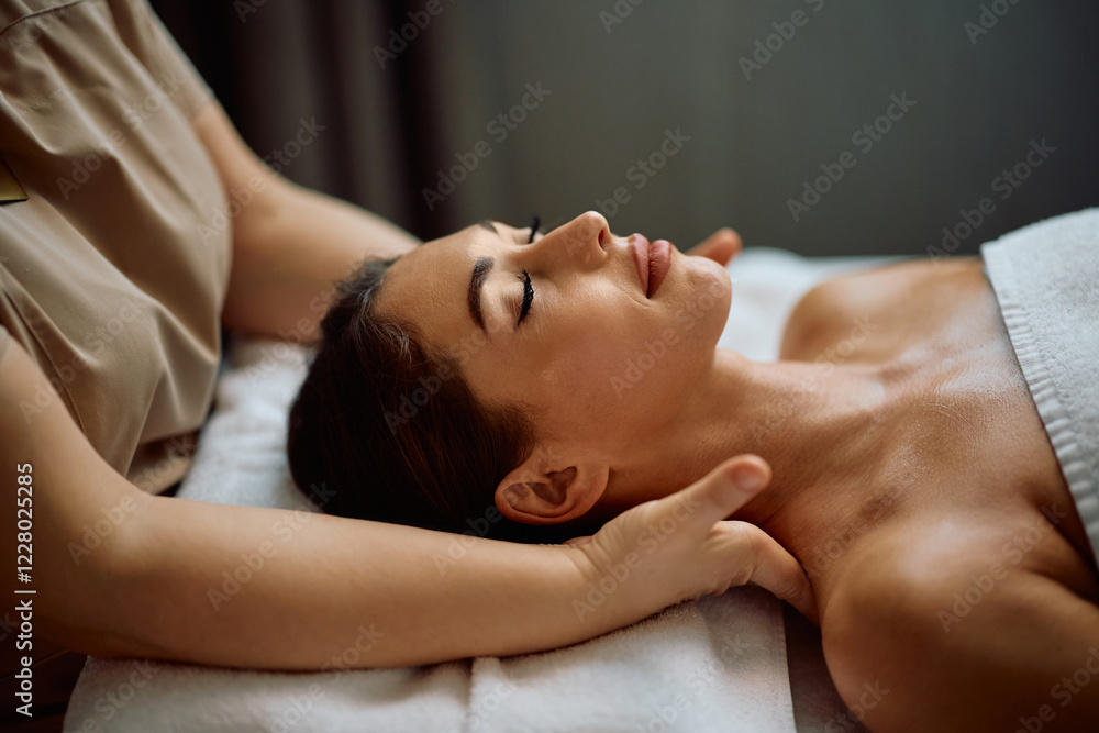 Woman with eyes closed enjoying in shoulder massage at spa. Woman with eyes closed enjoying in shoulder massage at spa.