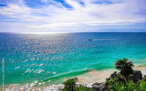 Boats at natural seascape panorama beach view Tulum ruins Mexico. photo