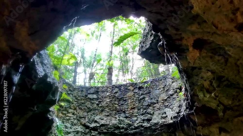 Cenote Park Yaxmulito with limestone rocks hole rainwater and plants. photo