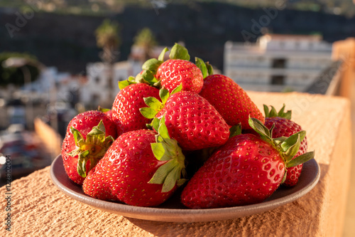 New harvest, plate with bio ripe red sweet strawberry from Tenerife, Canary islands, Spain, vegetarian food local grown fruits