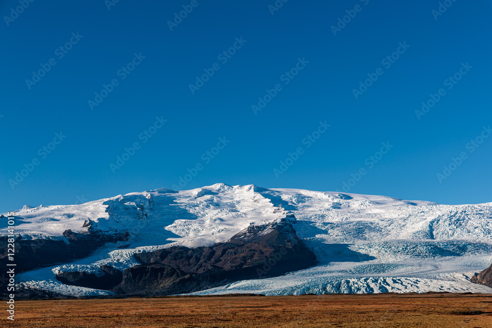 Glacier on the mountain range above Jokulsarlon glacial lake on the island of Iceland
