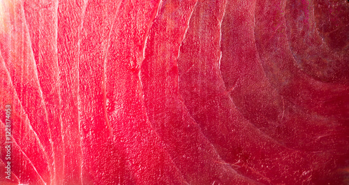 Tuna texture background, steak. Fresh raw tuna fish fillet close-up, sea fish backdrop, top view, flat lay. Fresh sliced bluefin tuna raw meat texture macro shot