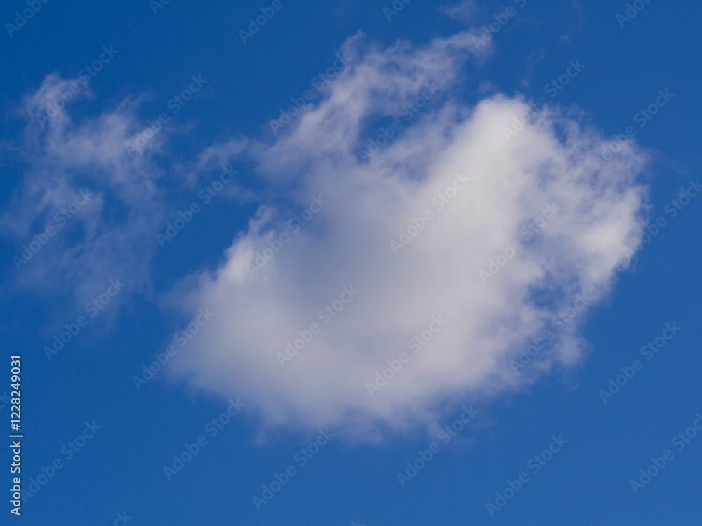 Expansive blue sky dotted with soft white clouds during midday light Expansive blue sky dotted with soft white clouds during midday light