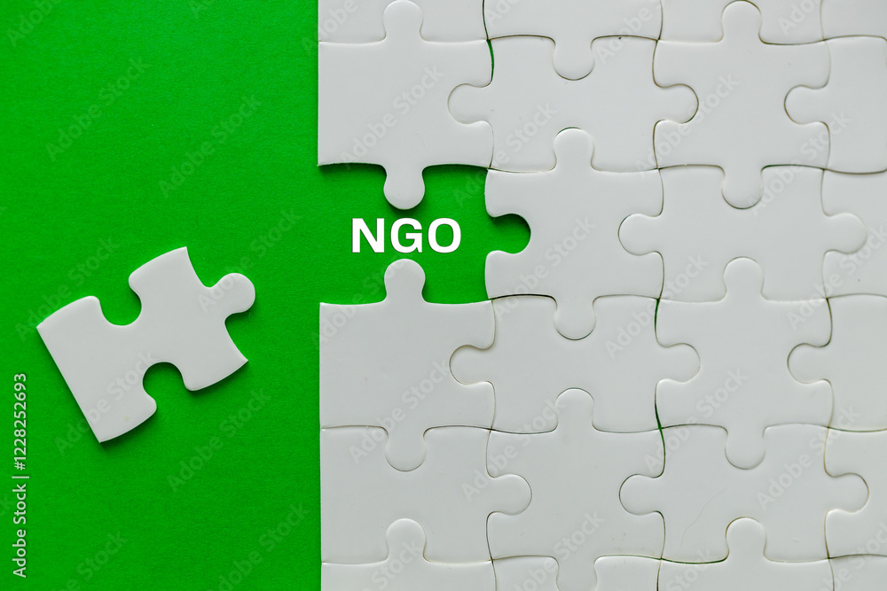 NGO Symbol. Taken out of the puzzle revealing the NGO Abbreviation.Concept of NGO Non-Governmental Organization and Charity. Donation, Foundation, Nongovernmental non profit organization, copy space