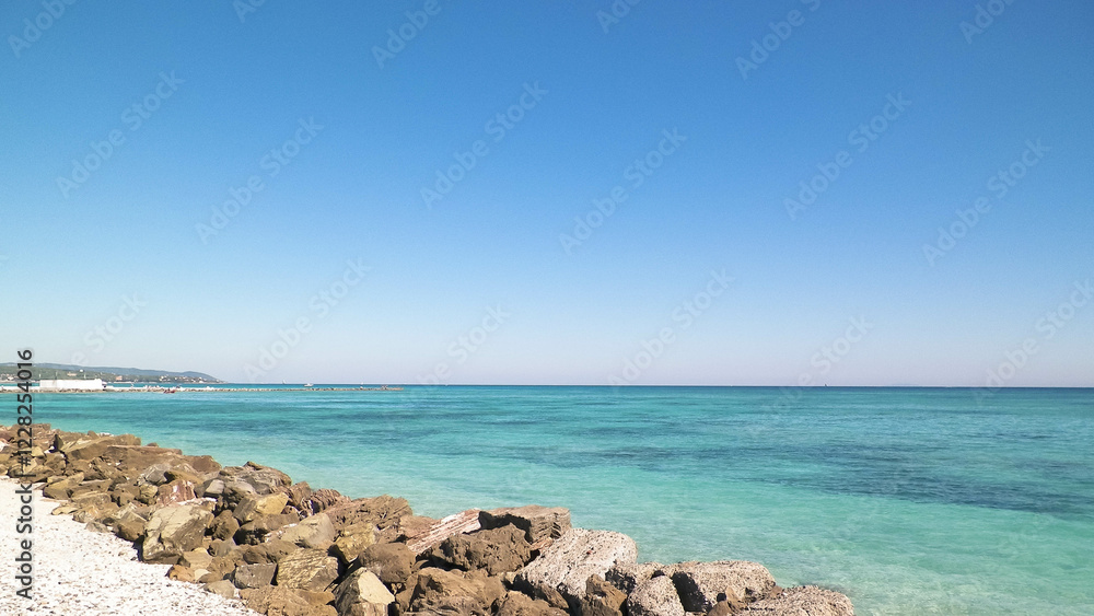 Breakwater on beach in Vada, Italy. Breakwater on beach in Vada, Italy.
