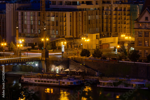 Night cityscape of the historic center of Prague. View from above of the old bridge and river photo