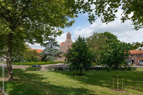 Exploring the charming green space of Noordhoek with the historical church in view on a sunny day photo