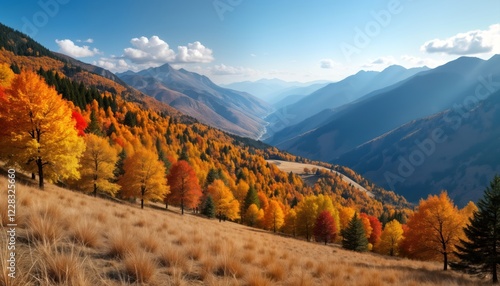 Fototapeta Naklejka Na Ścianę i Meble -  Autumn panorama of valley. Colorful trees on hillsides create vibrant landscape. Sunlight illuminates scene, vibrant autumn colors. Majestic mountain peaks form dramatic background. Clear sky adds to