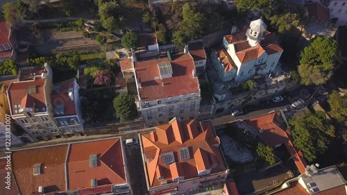 LISBON, PORTUGAL - JANUARY 22, 2025: Aerial view of vibrant rooftops in historic neighborhood showcasing architecture and urban life