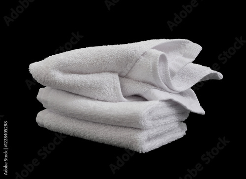 stack of messy white hand towels isolated