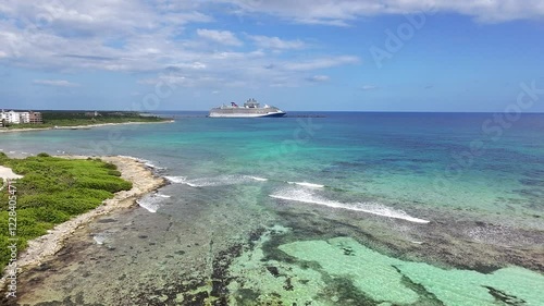 Costa Maya Mexico and the Caribbean Sea coastline with a cruise ship docked at the port. Mahahual Mexico shoreline and cruise port. 