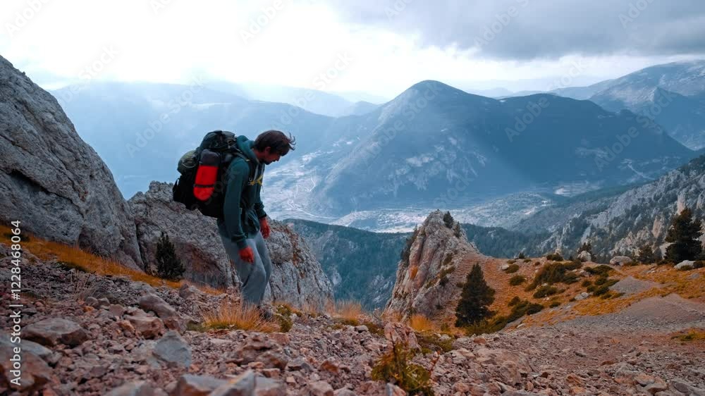 Hikers exploring rugged terrain in the Pyrenees of Spain during autumn Hikers exploring rugged terrain in the Pyrenees of Spain during autumn