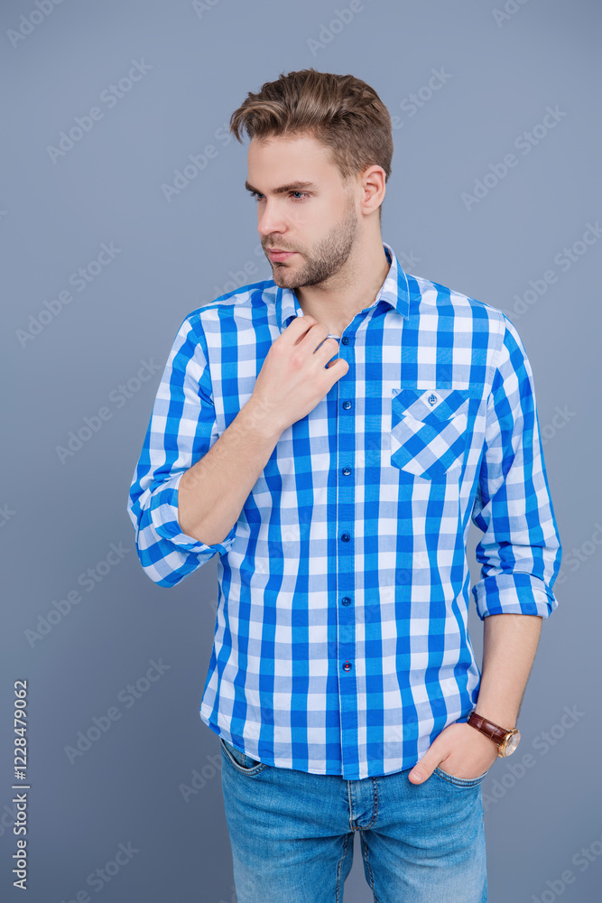 Obraz premium Casual style of millennial man. Portrait of man in casual style shirt. Stylish portrait of unshaven guy. Man isolated on grey. Millennial man wearing checkered shirt. Flannel shirt