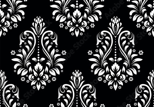 Wallpaper in the style of Baroque. Seamless vector background. White and black floral ornament. Graphic pattern for fabric, wallpaper, packaging. Ornate Damask flower ornament