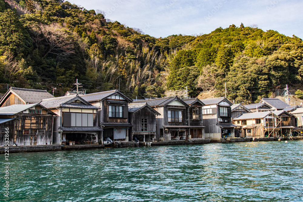 Naklejka premium Row of Traditional Japanese Boat Houses Along Waterfront, Ine, Kyoto, Japan