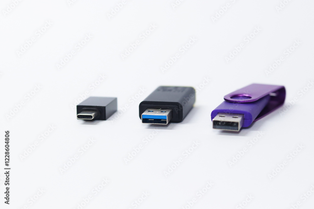 Three USB Flash drives with different technologies on white background. USB type-C, Micro-USB, USB 2.0 and 3.0 devices, pendrive with Gigabites of capacity GB Three USB Flash drives with different technologies on white background. USB type-C, Micro-USB, USB 2.0 and 3.0 devices, pendrive with Gigabites of capacity GB