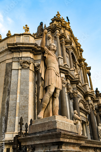 A statue of a roman figure outside an iconic cathedral photo