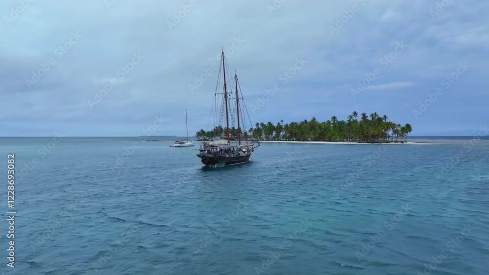 Drone past sailboat to island, San Blas Panama Drone past sailboat to island, San Blas Panama