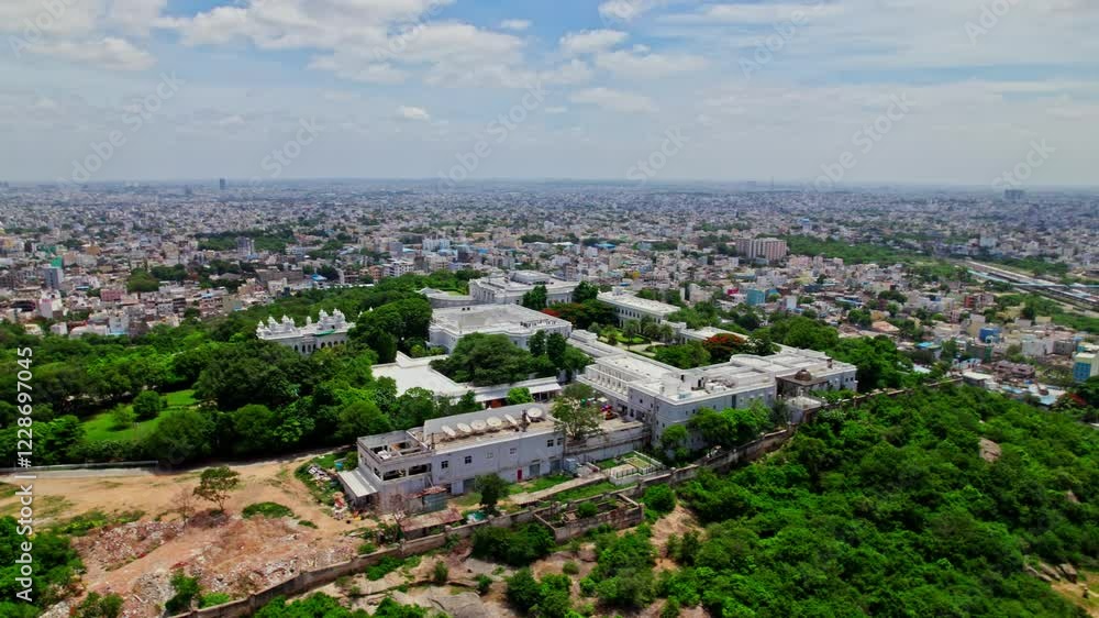 Taj Falaknuma Palace with hyderabad city view, sky and clouds at Engine Bowli, Falaknuma, Hyderabad, Telangana, india. day time, Semi orbit, drone shot, 4k Taj Falaknuma Palace with hyderabad city view, sky and clouds at Engine Bowli, Falaknuma, Hyderabad, Telangana, india. day time, Semi orbit, drone shot, 4k