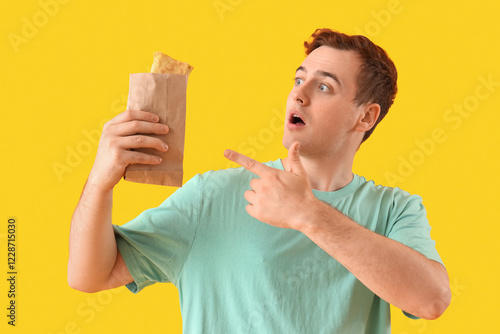 Shocked young man pointing ...