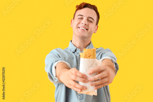 Young man with tasty sandwi...