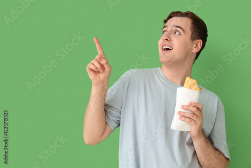 Young man with tasty sandwi...