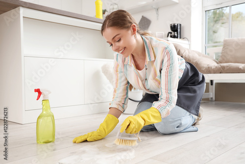 Female janitor cleaning flo...