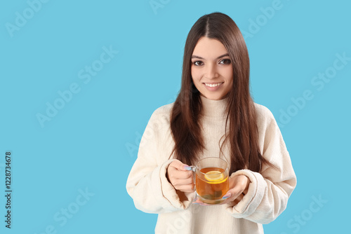Young woman with glass cup ...