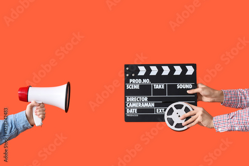 Hands with movie clapper, f...