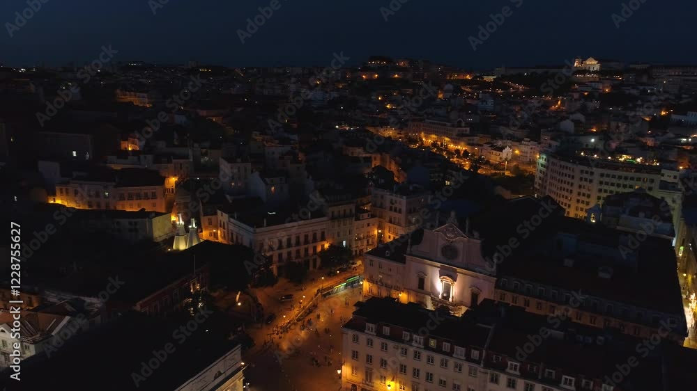 LISBON, PORTUGAL - JANUARY 22, 2025: Nighttime view of cityscape highlights and illuminated streets creating a vibrant atmosphere LISBON, PORTUGAL - JANUARY 22, 2025: Nighttime view of cityscape highlights and illuminated streets creating a vibrant atmosphere