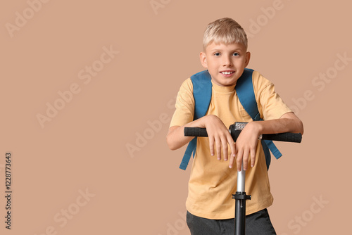 Cute schoolboy with modern ...