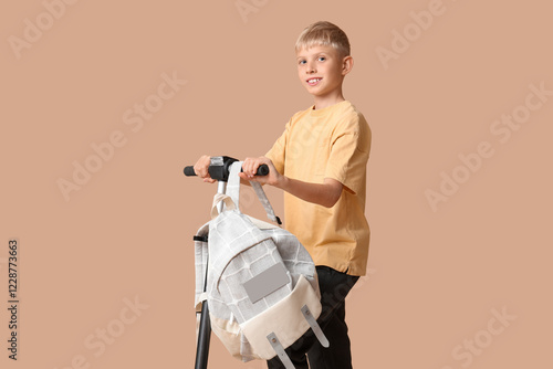 Cute schoolboy with modern ...