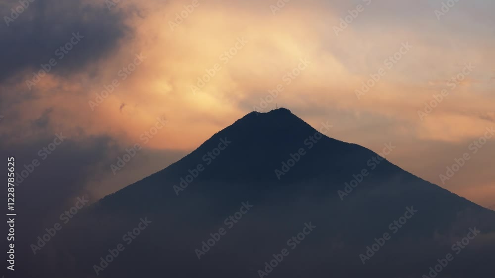 Volcan de Agua, near Antigua Guatamala, silhoutte at sunset, close up view of volcano cone with dramatic sky