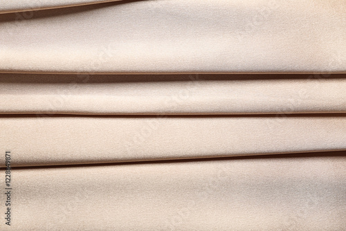 Layers of beige silk fabric as background