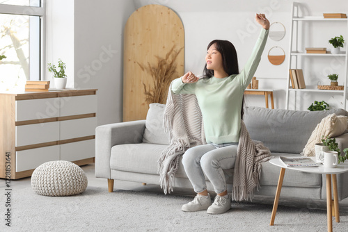 Young Asian woman with grey...