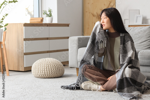 Young Asian woman with warm...