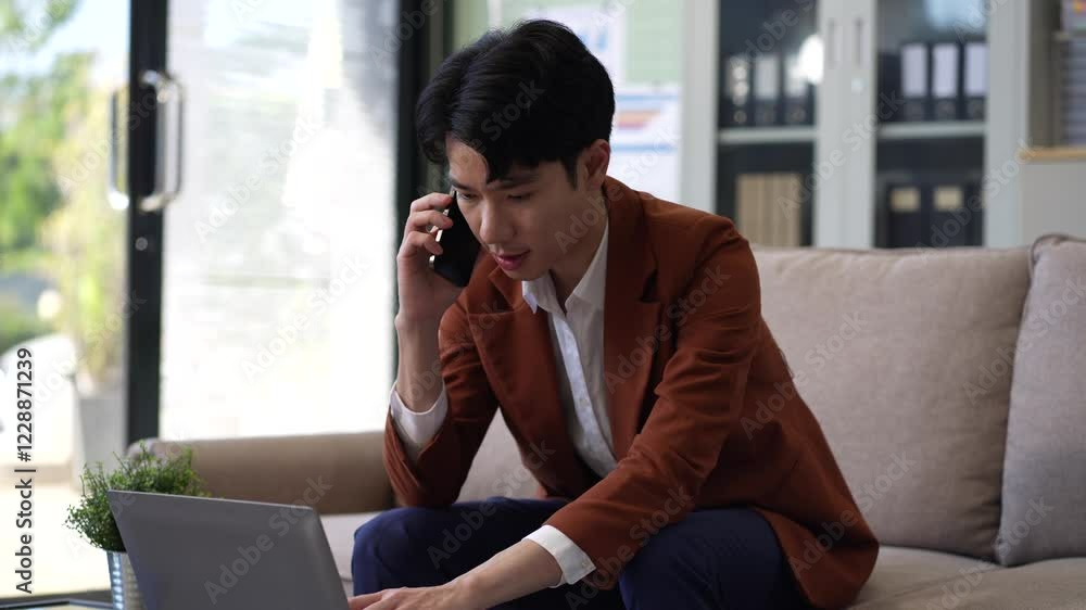 businessman involved in cellphone call conversation working on computer, giving professional consultation to client or negotiating project. businessman involved in cellphone call conversation working on computer, giving professional consultation to client or negotiating project.